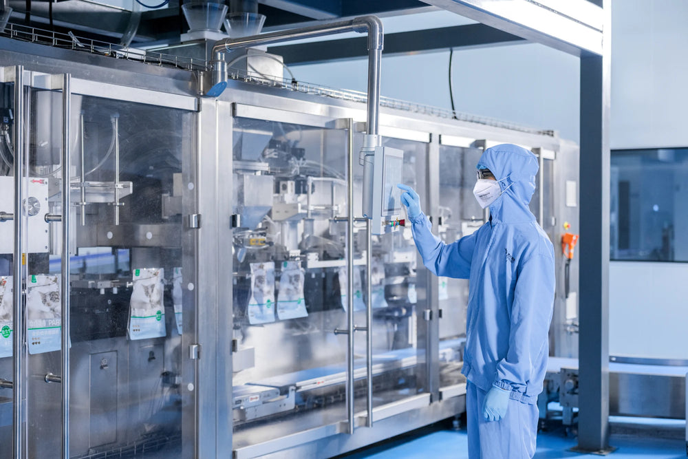 A team member monitoring packaging equipment.