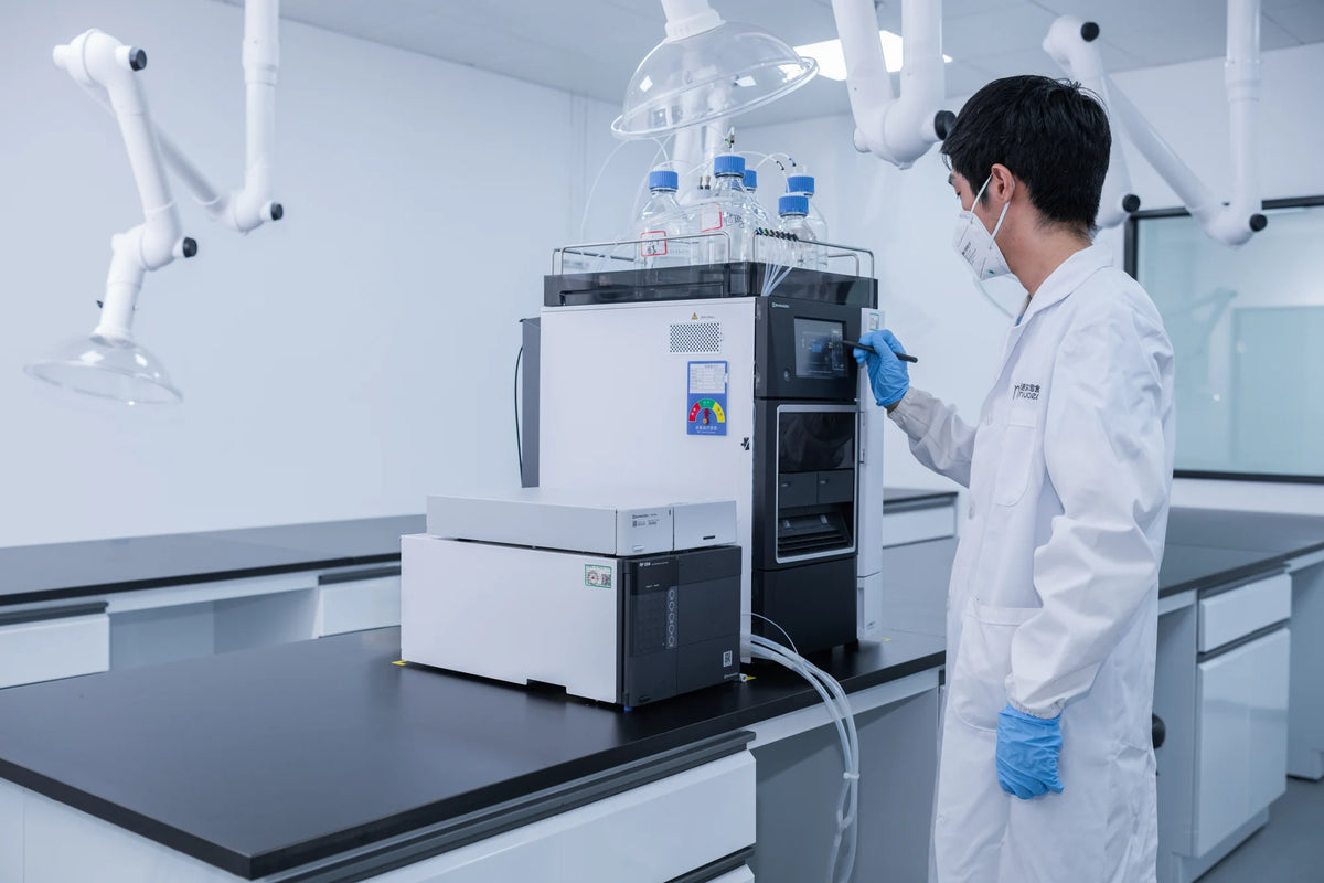 Laboratory equipment and a team member at the Nuoer facility.