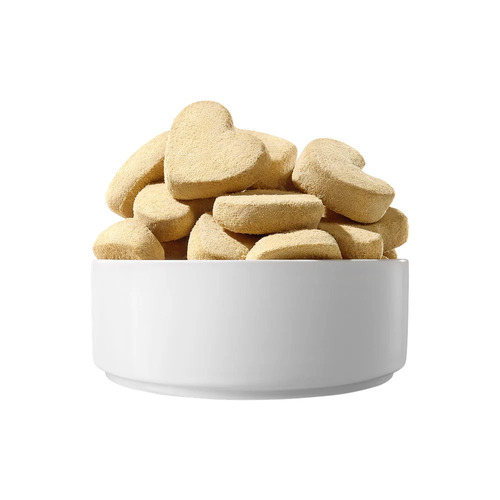 Real heart-shaped PARTNER rabbit freeze-dried pieces in a white bowl